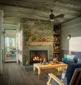 Living Room, Ceiling Lighting, Dark Hardwood Floor, Wood Burning Fireplace, Chair, Standard Layout Fireplace, Accent Lighting, Ottomans, Wall Lighting, Sofa, and Coffee Tables ©Jim Westphalen  Photo 7 of 11 in Fall Line by Birdseye