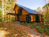 Exterior, Gable RoofLine, House Building Type, Flat RoofLine, Metal Roof Material, Wood Siding Material, and Cabin Building Type  Photo 14 of 28 in Quaker Bluff Estate by Birdseye