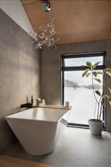 Bath Room, Freestanding Tub, Ceramic Tile Wall, Ceramic Tile Floor, Open Shower, and Pendant Lighting  Photo 11 of 14 in Farmhouse Extension by Daymark Design Incorporated