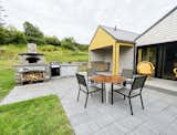 Outdoor, Large Patio, Porch, Deck, Pavers Patio, Porch, Deck, Hardscapes, Back Yard, and Decking Patio, Porch, Deck Outdoor kitchen with wood fired pizza oven  Photo 13 of 29 in The Hideaway at Baxters Harbour by Melissa Laforge