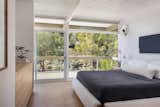 Primary Bedroom with Blueprint lighting sconces and Parachute bedding