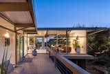 Walls of glass continue across the entire back elevation of the house