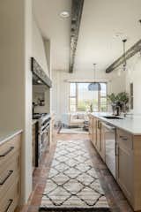 Inset rift white oak cabinets bring nature inside.