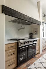 Full quartz backsplash and functional niches.
