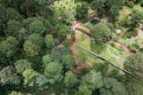 A new hill was formed, merging the house into its immediate context.