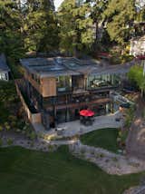 The highest level of sustainability drove the design. High-efficiency heat pump (heating and cooling), water heating, appliances, energy recovery ventilation system, lighting and controls and electric vehicle charging is provided by the sun and 45 photo-voltaic panels (hidden on the roofs). The house produces more energy than it uses. All aspects of the design and construction from robust insulation and building envelope, doors + windows and landscape, to the use of healthy interior finishes and the recycling of construction materials were guided by maximum sustainability. The completed residence received a 5-star + Built Green Certification in 2022. 