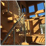 Staircase, Wood Tread, and Metal Railing Stairs in the Sunspace, Meridian  Photo 6 of 13 in Meridian by Enertia Building Systems Inc.