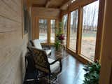 Windows, Picture Window Type, Wood, and Sliding Window Type Basement level of the AQ-1 tower sunspace  Photo 2 of 8 in Aquarius 1 Mass Timber Geo-Solar home by Enertia® by Enertia Building Systems Inc.
