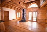 Backup Woodstove in the Living Room. Doors, window, and arch, open to the sunspace.
