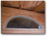Opening in the upper sunspace, allows heat to circulate in Winter, to escape in Summer