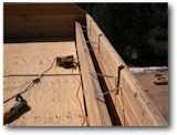 The North mass timber airshaft under construction, ready for the rafters to be dropped in place.