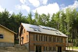 Exterior, House Building Type, Gable RoofLine, Metal Roof Material, and Prefab Building Type South View - Enertia® Equinox in the NC mountains  Photo 1 of 8 in Equinox - Mass Timber Prefab by Enertia Building Systems Inc.