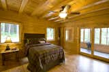 Main Floor Bedroom, opening to the sunspace Warm Wood and Windows.