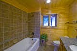Bath Room, Two Piece Toilet, Engineered Quartz Counter, Undermount Sink, Ceramic Tile Floor, Alcove Tub, Ceiling Lighting, and Ceramic Tile Wall Equinox - Bath  Photo 7 of 8 in Equinox - Mass Timber Prefab by Enertia Building Systems Inc.
