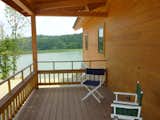 Outdoor, Large Patio, Porch, Deck, Back Yard, Wood Patio, Porch, Deck, and Hanging Lighting North Deck. Lakeside Lodge  Photo 9 of 12 in Lakeside Lodge (Custom) by Enertia Building Systems Inc.