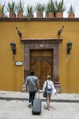 You will immediately know you've arrived at Casa Proserpina when you see the massive wooden front door and the yellow walls. Casa Proserpina contains two Casitas (Casita Agua + Casita Fuego), as well as Casa Centro and they all sit behind this main entrance to the hacienda-style home.