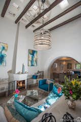 Casita Agua gets its name from the blue touches that decorate the interior space. The living room has tall ceilings and one of the original archways leads you into the kitchen, dining space and stairway to the second floor.