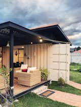 Outdoor, Grass, Walkways, Hanging Lighting, Metal Patio, Porch, Deck, Small Patio, Porch, Deck, and Metal Fences, Wall  Photo 6 of 14 in Tiny Home Shipping Container by Pablo Cisneros R.
