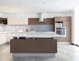 Kitchen, Quartzite Counter, Wall Oven, Cooktops, Mosaic Tile Backsplashe, Refrigerator, Porcelain Tile Floor, Undermount Sink, Ceiling Lighting, Wood Cabinet, and Microwave  Photo 13 of 14 in PS HOUSE by Pablo Cisneros R.