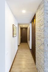 Hallway and Light Hardwood Floor  Photo 14 of 14 in PS HOUSE by Pablo Cisneros R.