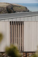 Exterior, Wood Siding Material, House Building Type, Hipped RoofLine, and Metal Roof Material External details of timber louvres with zinc roof.  Photo 6 of 18 in Green Hedges by Watershedd
