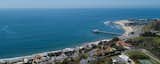 The house overlooks the Pacific Ocean and pier.