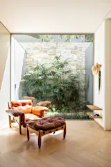 A framed garden in the Gallery. Mole arm chair designed by Sergio Rodrigues.