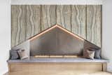 Concrete hearth, steel back, and stone panels at mantel fireplace