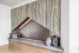Concrete hearth, steel back, and stone panels at mantel fireplace