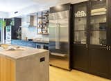 Concrete countertop, oak panel, metal laminated drawers and subway tiles for the kitchen. Wolf and Sub Zero appliances.