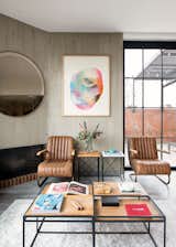 Living Room, Ottomans, Dark Hardwood Floor, Coffee Tables, and Corner Fireplace  Photo 1 of 10 in Virrey Apartment by Nicolas Mujica