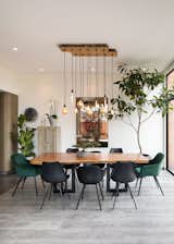Dining Room, Dark Hardwood Floor, Pendant Lighting, Chair, and Lamps  Photo 3 of 10 in Virrey Apartment by Nicolas Mujica