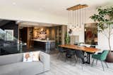 Dining Room, Chair, Lamps, Dark Hardwood Floor, Pendant Lighting, and Table  Photo 4 of 10 in Virrey Apartment by Nicolas Mujica