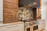 Kitchen, Wood Cabinet, Wood Counter, Cooktops, Range Hood, Range, and Marble Counter Main Kitchen   Photo 13 of 19 in Mid Century Modern by Tongue & Groove Design + Build