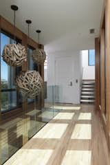 Hallway and Light Hardwood Floor  Photo 10 of 26 in The Shipwreck House Asks $4.85 M by Tongue & Groove Design + Build