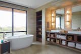 Bath Room, Marble Counter, Vessel Sink, Pendant Lighting, Wall Lighting, Freestanding Tub, and Soaking Tub  Photo 15 of 26 in The Shipwreck House Asks $4.85 M by Tongue & Groove Design + Build