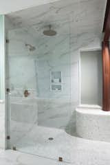 Bath Room, Marble Counter, Porcelain Tile Floor, Corner Shower, Drop In Sink, Marble Wall, Soaking Tub, and Open Shower  Photo 17 of 18 in Modern Beach House by Tongue & Groove Design + Build