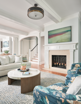 Living Room, Chair, Wood Burning Fireplace, Sofa, Standard Layout Fireplace, Coffee Tables, Ceiling Lighting, Accent Lighting, and Medium Hardwood Floor Living Room   Photo 3 of 30 in Gray Gables by Tongue & Groove Design + Build