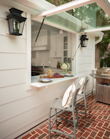 Dining Room, Pendant Lighting, and Stools Indoor/Outdoor Bar Dining   Photo 7 of 30 in Gray Gables by Tongue & Groove Design + Build