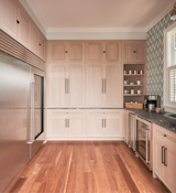 Kitchen, Marble Counter, Wood Cabinet, Ice Maker, Vessel Sink, Mosaic Tile Backsplashe, Refrigerator, Pendant Lighting, Wine Cooler, and Medium Hardwood Floor Butler Pantry  Photo 12 of 30 in Gray Gables by Tongue & Groove Design + Build