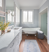 Bath Room, Medium Hardwood Floor, Freestanding Tub, Drop In Sink, Marble Counter, and Soaking Tub Guest Bathroom   Photo 18 of 30 in Gray Gables by Tongue & Groove Design + Build
