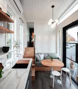 Gooseneck Tiny home with storage seating and Parisian Trim Work by Tru Form Tiny