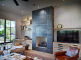 Steel clad fireplace, pecan shelves and cabinets
