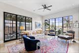 Smooth sealed concrete and large clad wood window compliment the warm furnishings.