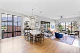 A custom chandelier and narrow white oak floor add to the warmth.