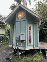 On demand propane tankless hot water heater and electrical box mounted on the trailer tongue side of this Paradise- covered by the eave.  1x6 windows keep natural light coming into the bathroom vanity area. Outdoor spigots included of course (2 of them) and exterior outlets. 