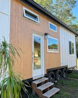 Exterior, Glass Siding Material, Tiny Home Building Type, Metal Roof Material, ADU Building Type, Wood Siding Material, Beach House Building Type, Small Home Building Type, and Gable RoofLine  Photo 6 of 41 in The 5th Paradise Model ATU- Built By: paradisetinyhomes.com by elliekdesign.com