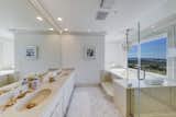 The primary suite bathroom is complete with a soaking tub, dual vanity, stall shower and private water closet.  Photo 8 of 14 in A Northern Californian Home With Postcard-Worthy Views Seeks $8M