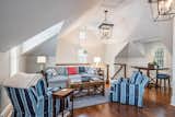 The carriage house’s main living space features a vaulted ceiling and window nooks.