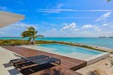 The main villa overlooks a freshwater infinity pool with a chlorine-generating cleaning system.  Just beyond is an unobstructed view of the sea.  Photo 3 of 12 in An Eco-Minded Resort in the Bahamas Lists for $2.95M